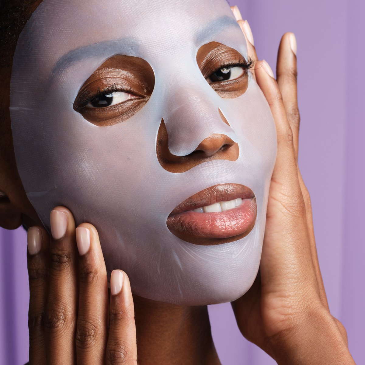 Shot of model with Luminous Deep Hydration Lifting Mask applied to face.
